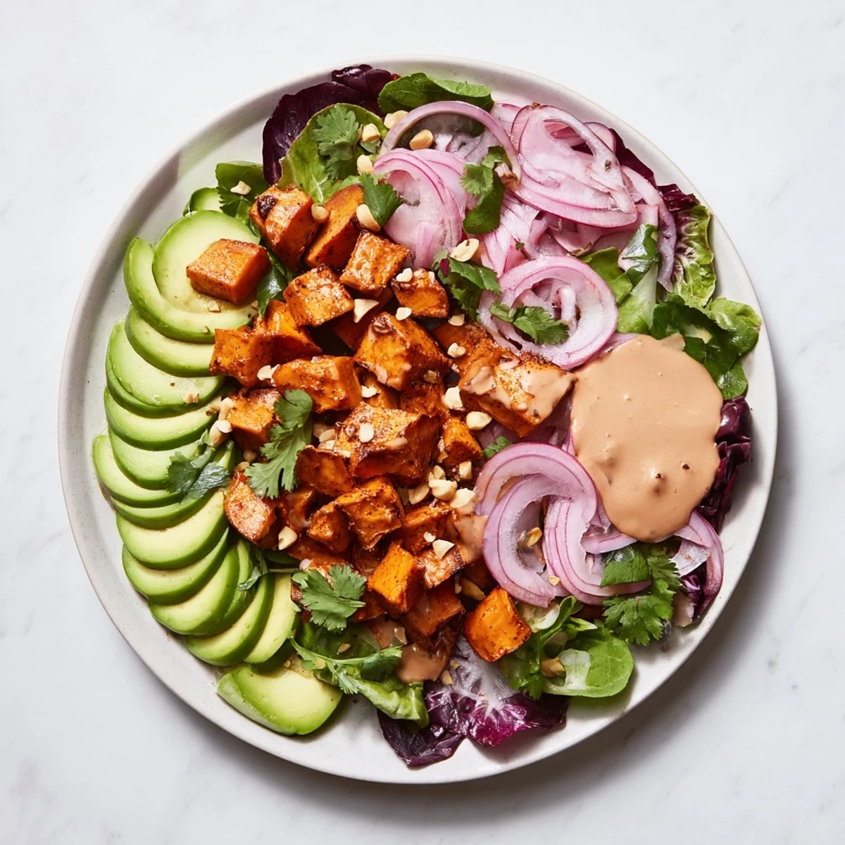 This Spiced Peanut Sweet Potato & Radicchio Salad Bowl displays colorful ingredients, perfectly composed for a light dinner.