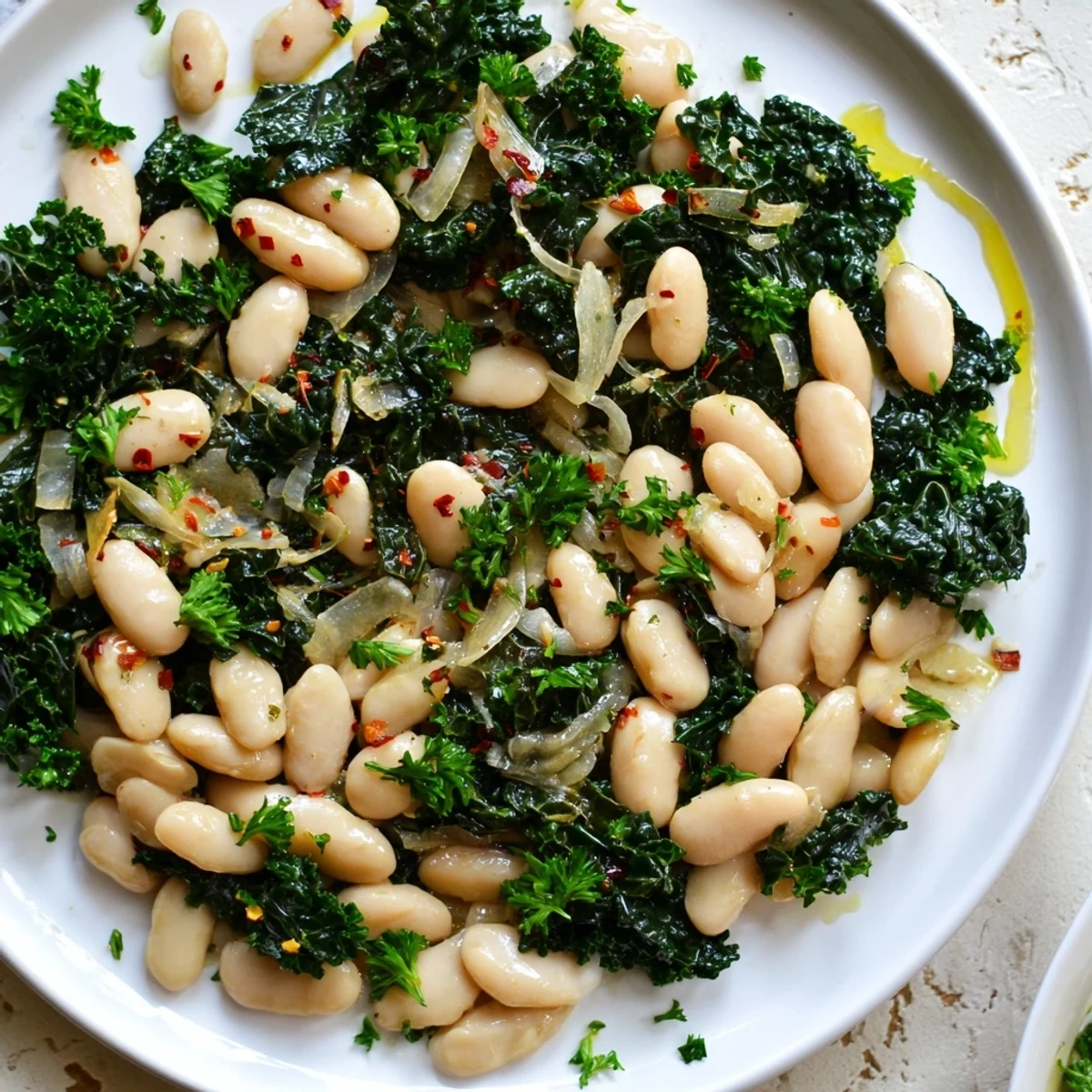 Rustic serving of Garlicky Beans with Winter Greens; a comforting, garlicky vegetarian dish.