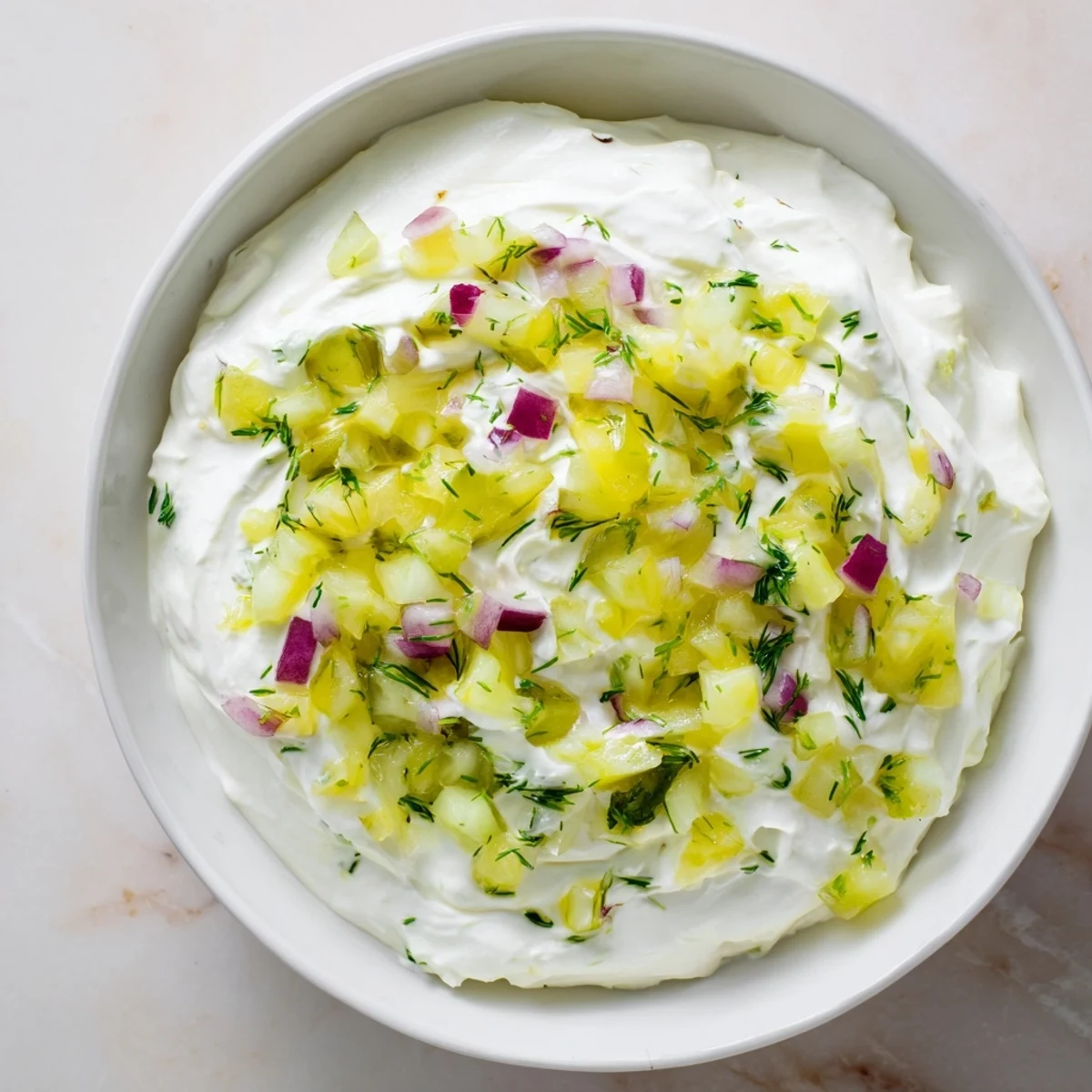 A close-up of vibrant Sweet and Sour Pickle Relish Dip, a tangy, flavorful appetizer ready to eat.