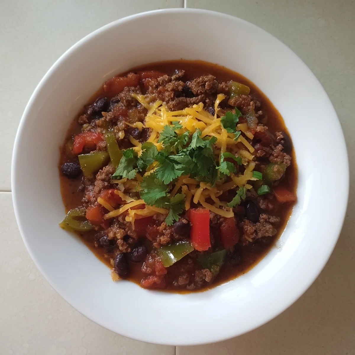 A close-up of a flavorful quick chili with canned beans, perfect for a cozy weeknight dinner.