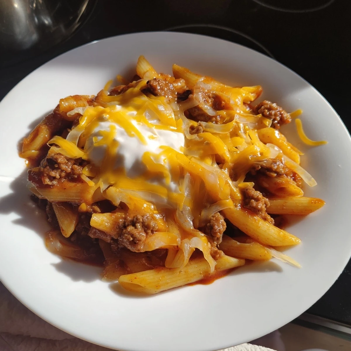 Zesty Easy Beef Enchilada Pasta, a quick weeknight dinner, delivers rich flavors in every bite.