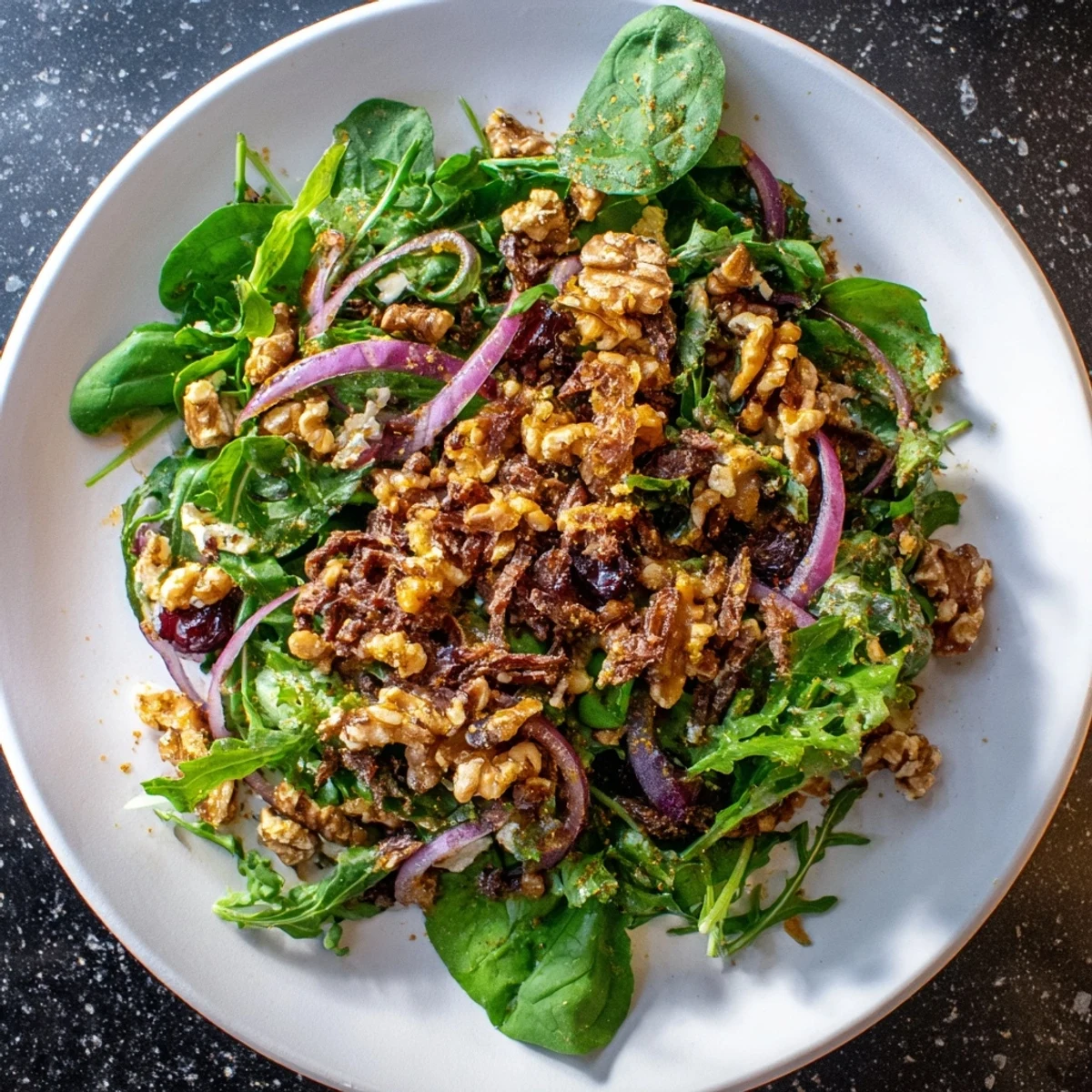 Spiced Honey and Date Goat Cheese Salad with creamy goat cheese and vibrant greens ready to eat.