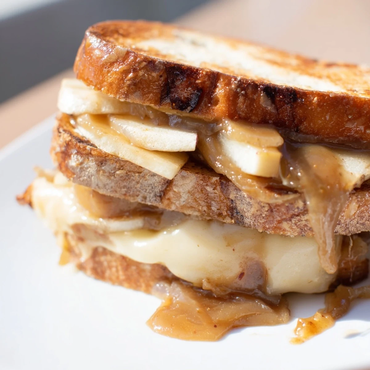This Caramelized Onion, Apple & Cheddar Grilled Cheese showcases layers of savory onions and sharp cheddar inside.