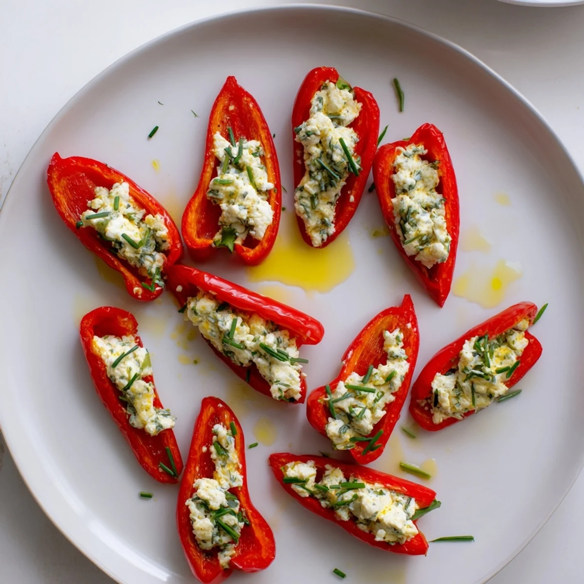 Mediterranean flavors shine in this photo of mini bell pepper halves and feta filling appetizer.