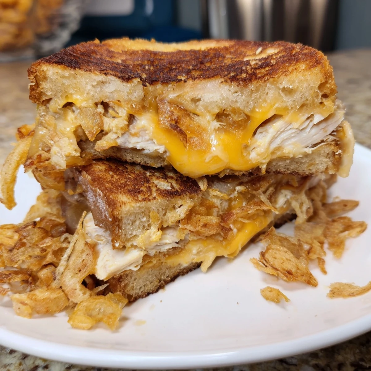 Crispy Shallot Chicken Grilled Cheese, golden brown and oozing cheese, perfect for a cozy lunch.