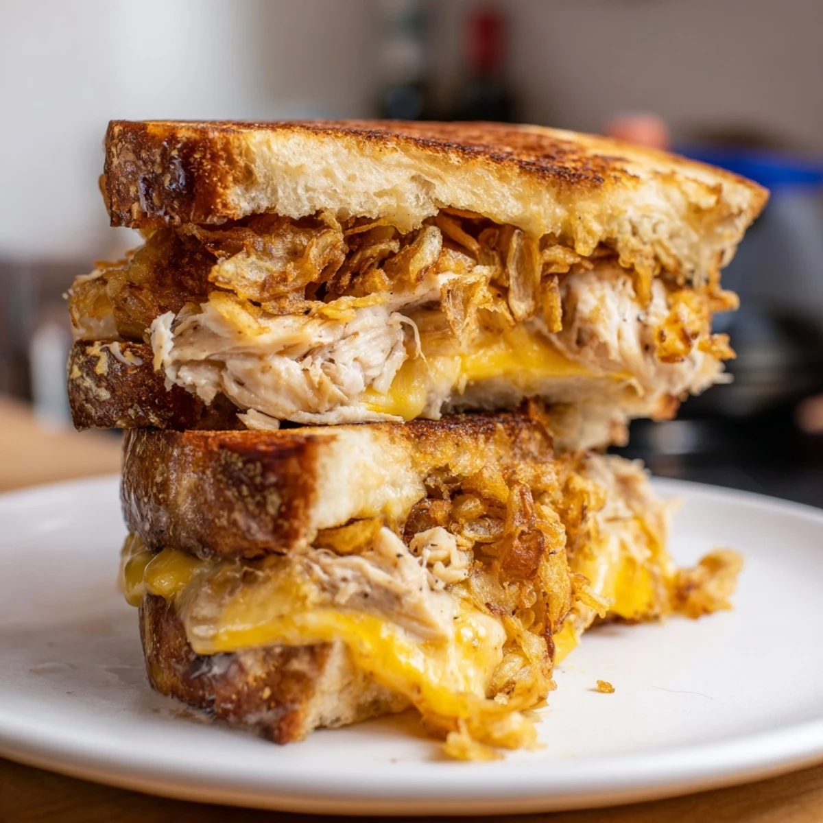 Delicious, melty bite into a rich Crispy Shallot Chicken Grilled Cheese, with fried shallots adding great flavor and texture.