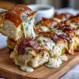 Derby Party Hot Brown Sliders on Brioche Buns with melted Gruyère and crispy bacon