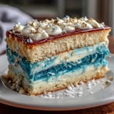 Rich vanilla buttercream frosted cake with elegant gold accents, perfect for boys.