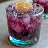 Refreshing Purple Rain Lavender Lemonade Refresher boasts lavender, lemon, and grape juice.