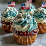 Delicious Star-Spangled Banner Cupcakes, perfectly frosted with patriotic swirls for any celebration.