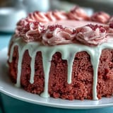 Moist pink velvet cake, subtly rosé infused, drizzled with liquid gold for celebrations.