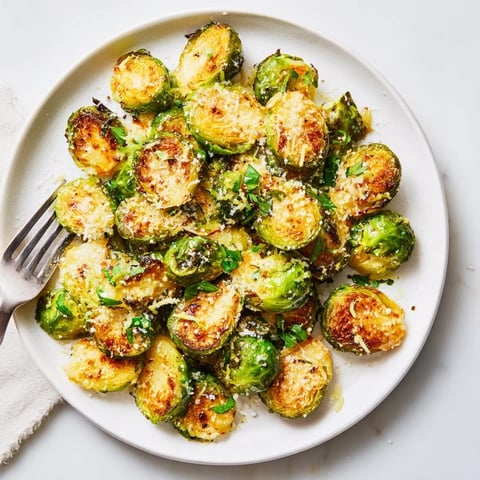 Crispy Parmesan Brussels Sprouts drizzled with olive oil, golden and savory side dish.  