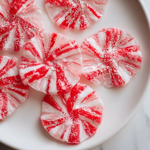 Express Peppermint Candy Bows glistening with edible glitter, a festive and fun holiday treat.