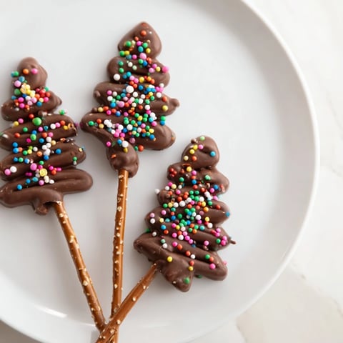 Gooey, zigzagged Express Chocolate Christmas Trees, ready for sprinkles and edible stars for holiday fun.