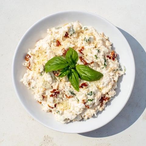 Creamy Lightened Marry Me Chicken Dip, bubbly and golden, served with colorful veggie sticks.