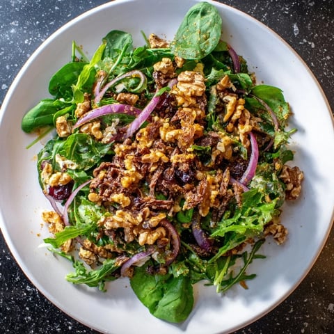 Spiced Honey and Date Goat Cheese Salad with creamy goat cheese and vibrant greens ready to eat.