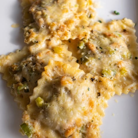 Golden, bubbly Chicken Pot Pie Ravioli Bake with melted cheese and delicious chicken and veggies.