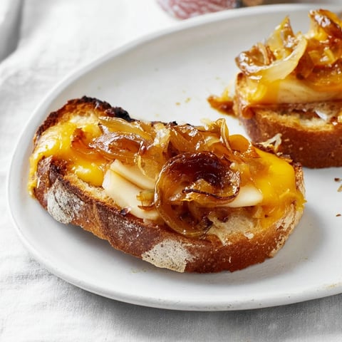 Golden brown Caramelized Onion, Apple & Cheddar Grilled Cheese, oozing with melted cheese and fresh apples.