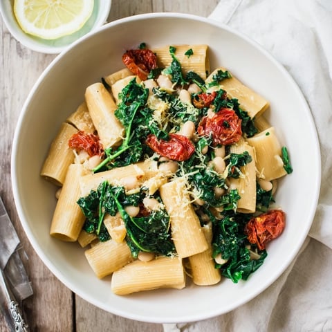 Steamy bowl of Healthy Tuscan White Bean & Kale Christmas Pasta, perfect for a cozy, festive Italian meal.