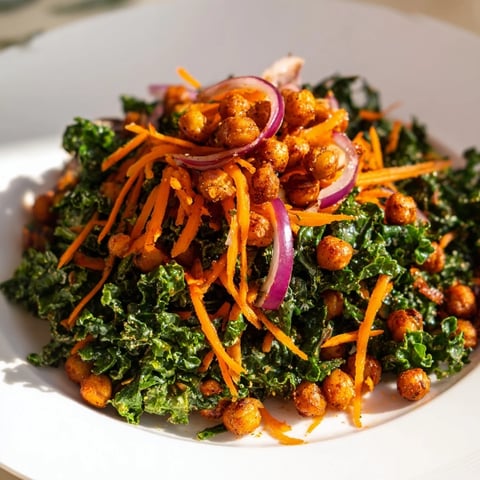 Crispy roasted chickpeas topping a vibrant kale salad, a healthy and delicious meal.
