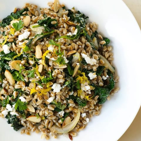 A vibrant, close-up shot of a comforting Farro & Greens Pilaf ready to enjoy as a flavorful meal.