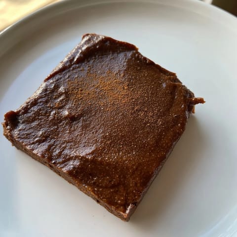 Warm, fudgy Pumpkin Workout Brownies, a delicious gluten-free treat waiting to be enjoyed.