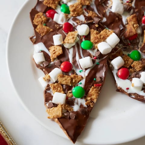 Golden marshmallows atop dark chocolate in this Quick Christmas Smores Bark recipe, perfect for holiday treats.