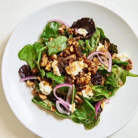 Elegant Spiced Honey and Date Goat Cheese Salad with sweet dates, drizzled with warm honey dressing.