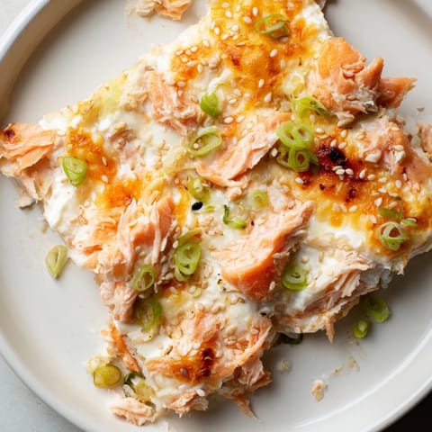 Hot, cheesy Creamy Salmon Sushi Bake: envision a beautiful, warm casserole ready to scoop with nori sheets.