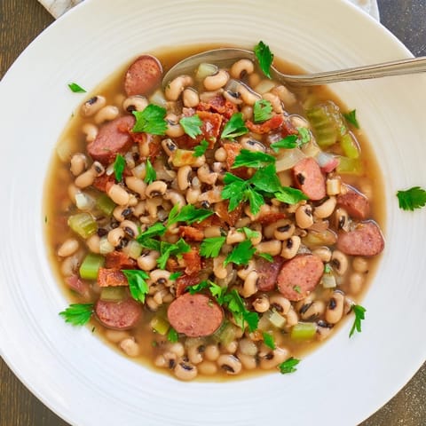 A comforting bowl of Southern-Style Black-Eyed Peas, rich with spices and bacon.