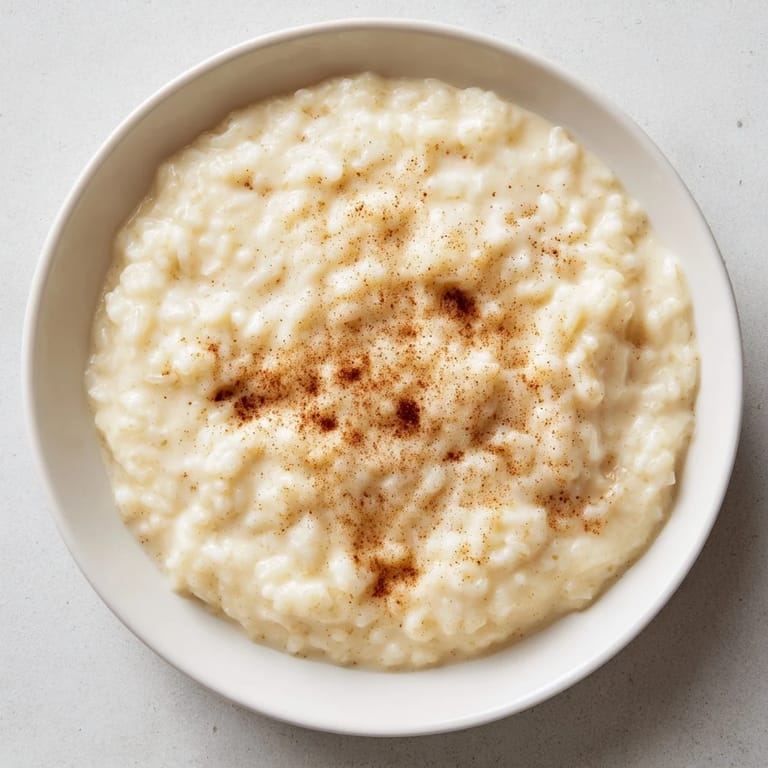 Imagine a comforting spoonful of sweet Rice Pudding with Leftover Rice, perfectly smooth and gently spiced.