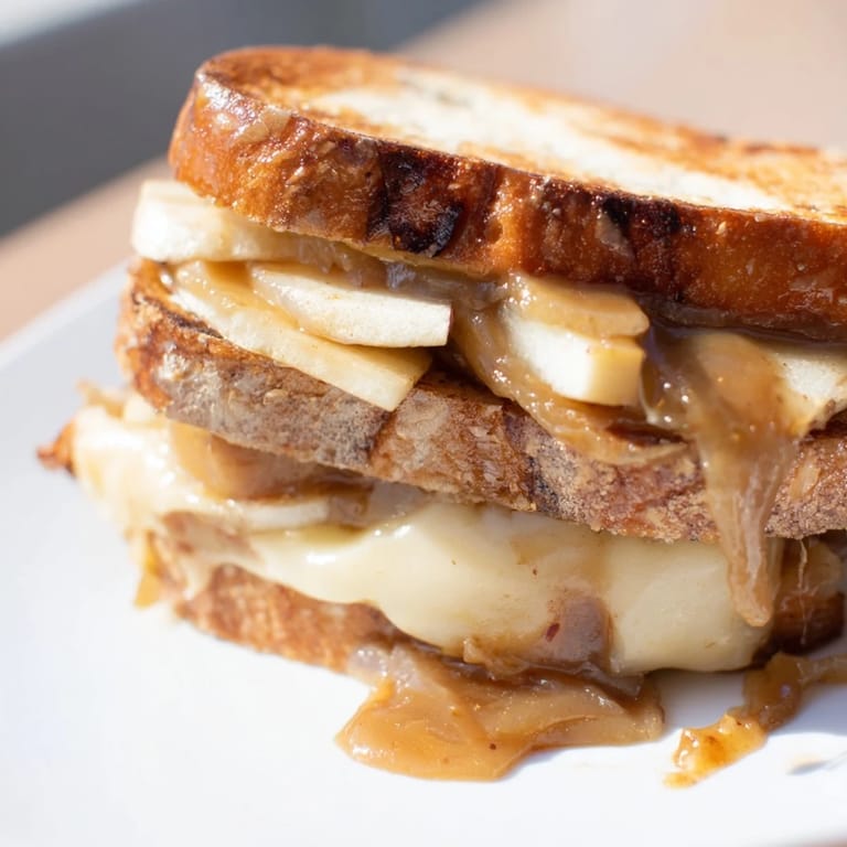This Caramelized Onion, Apple & Cheddar Grilled Cheese showcases layers of savory onions and sharp cheddar inside.