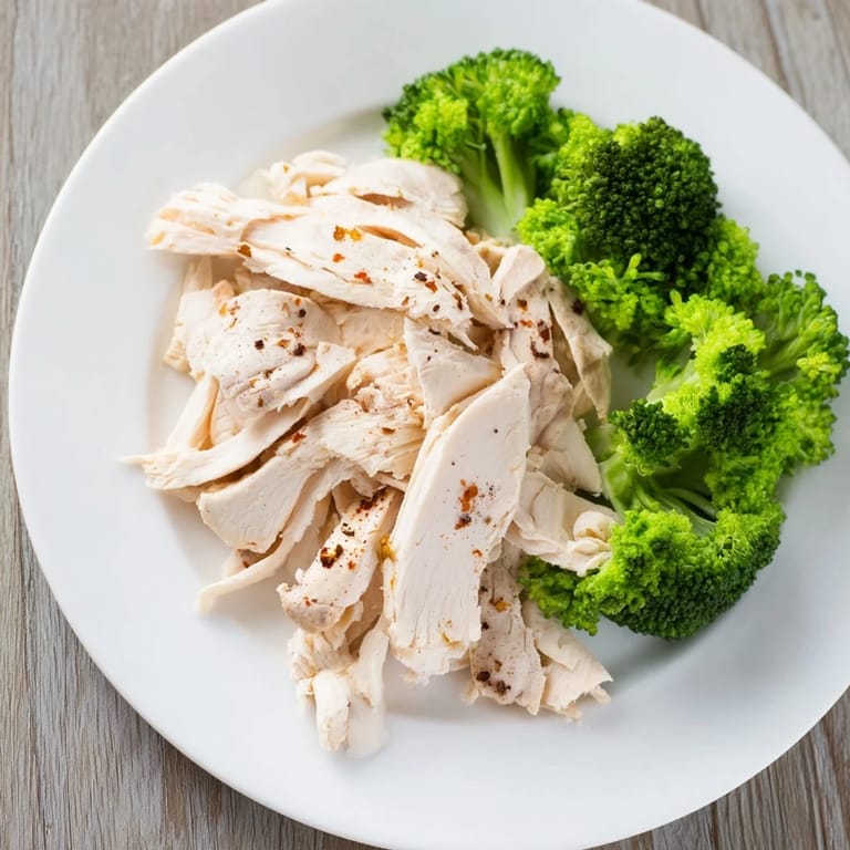 Freshly steamed Microwave-Steamed Chicken and Broccoli: the vibrant green broccoli and perfectly cooked chicken are delicious.