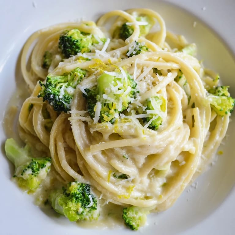 Steamy One-Pot Lemon Broccoli Pasta in a skillet, showcasing vibrant broccoli and zesty lemon zest.