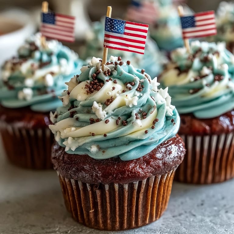 Easy Star-Spangled Banner Cupcakes crowned with edible American flags, ready to bake.