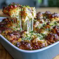 Savory ham and cheese croissant bake casserole with buttery croissants, smoky ham, and melty Gruyère baked in a rich egg custard.