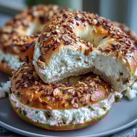 Fluffy high-protein bagels topped with savory everything seasoning, baked golden brown for a nutritious breakfast or snack.